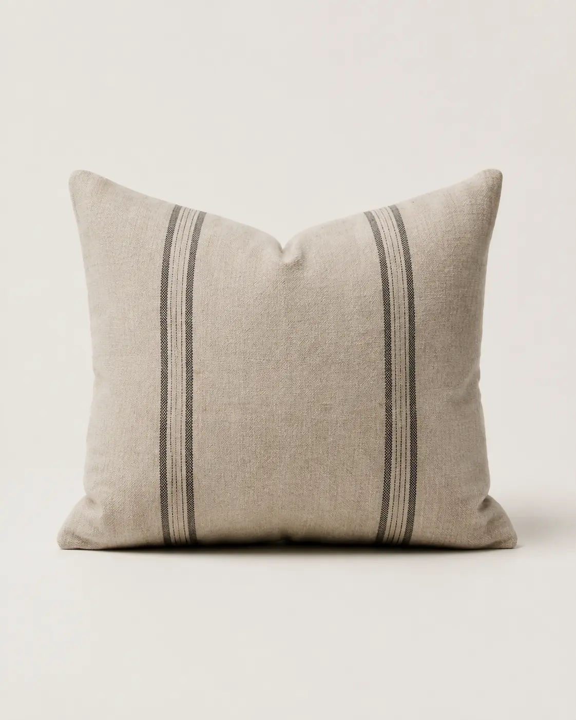 Folded natural linen throw with charcoal stripe