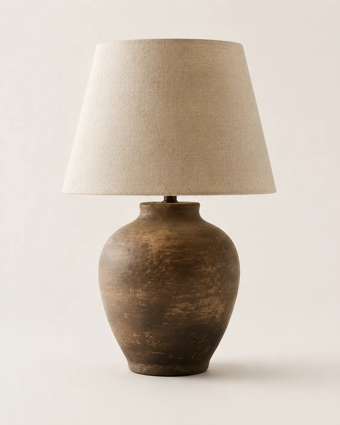 Stoneware table lamp with warm linen shade